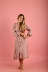 portrait of a woman in pink dress