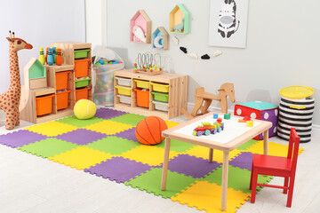 Cute child's room interior with toys and modern furniture
