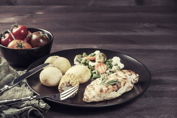 Fried chicken fillet and boiled vegetables