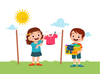 Naklejka premium little kid helping to do chores and dry the clothes outside