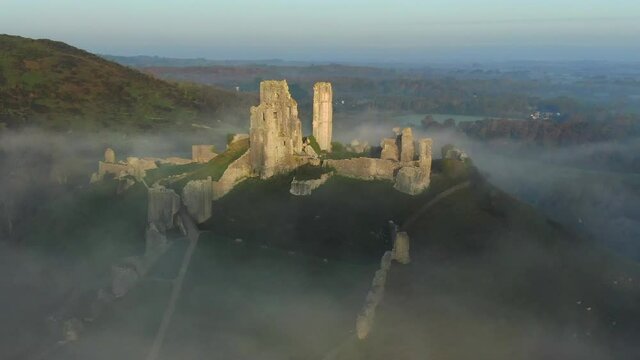Aerial footage of Corfe Castle, Corfe, Isle of Purbeck, Dorset, England