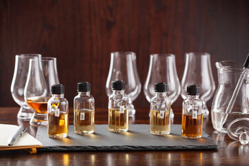 tasting bottles and glasses of whisky spirit brandy cognac. tasting at home