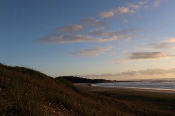Morning has opened up the skies of Pippi beach in Yamba Australia. Long stretched white and clear shore, perfect for a morning walk or swim.