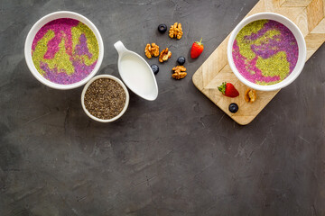 Obraz na płótnie Canvas Vegan Acai detox smoothie bowles with berries and chia seeds