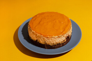 homemade cheese cake on grey plate with hard light