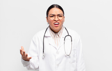 hispanic woman looking angry, annoyed and frustrated screaming wtf or what’s wrong with you