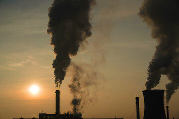 The chimney of a thermal power plant, the smoke extracted by a thermal power plant on the chimney, in the production process. Environment. Pollution.