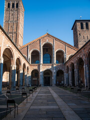 Fototapeta premium Milan, Italy - December 26, 2020: Atrium of Ansperto in the Sant'Ambrogio basilica with spaced chairs for security