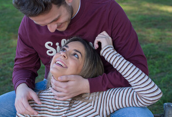 Portrait Of Happy Love Couple.
Stock Photo Of Happy Moment Of A Caucasian Couple Of Lovers Having Fun In The Park. They Are In Extremadura-España