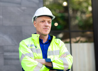 Portrait of Technician Electrical Engineer at rooftop building. Clean and green alternative energy concept.