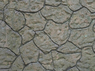 Gray brown wall with decorative imitation of stonework. Texture not seamless