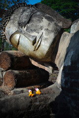 Ancient Buddha sleep in Wat Phra Kaew Kamphaeng Phet Historical Park ,THailand