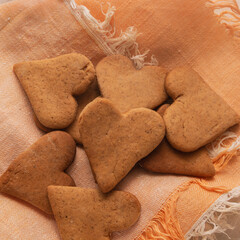 Heart shaped ginger craft cookie lies on a napkin