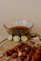 Assorted Delicious Pork Meat Barbecue with Vegetables and Spices on a Chopping Board with Sauce