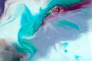 Fototapeta na wymiar Bright flowing alcohol Ink dark colors on blue background. Acrylic Fluid Art. Liquid marble texture for abstract artwork. Transparent creativity.