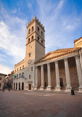 Fototapeta na wymiar Assisi, Popolo tower and Santa Maria Minerva church. Umbria, Italy.