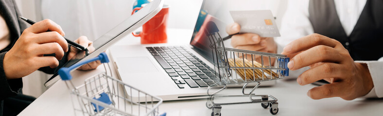 businesswoman hand using smart phone, tablet payments and holding credit card online shopping, omni...