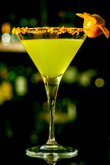 Toned cocktails are placed on the bar counter