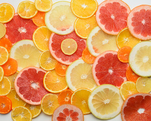 citrus fruits cut into round pieces: orange, grapefruit, lemon, tangerine. Ripe and juicy fruits