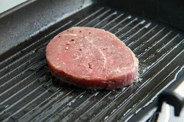 Fried steak on the grill