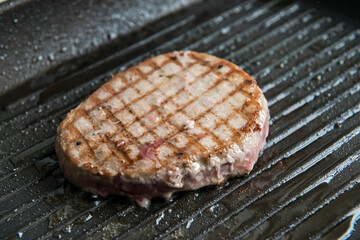 Fried steak on the grill