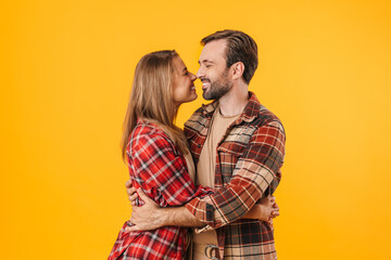 Beautiful happy couple hugging and smiling at each other