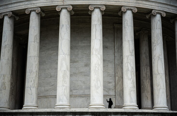 Tourist taking pictures of Thomas Jefferson Memorial in Washington DC
