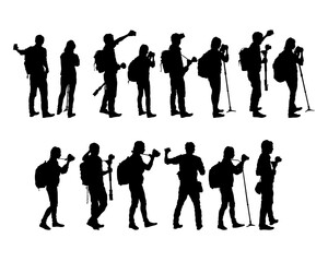 Woman and man holds a camera in her hand. Isolated silhouettes of people on a white background