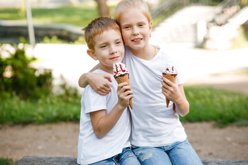 Children eat ice cream in the park.