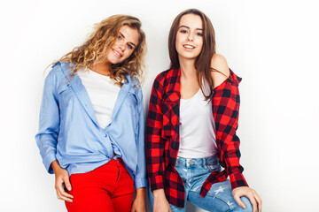 best friends teenage girls together having fun, posing emotional on white background, besties happy smiling, lifestyle people concept, blond and brunette multi nations