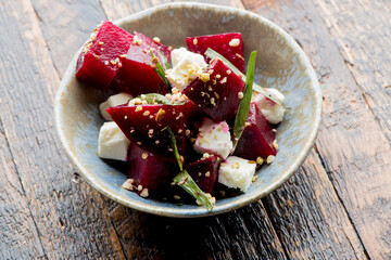 Beet salad. Classic Italian salad with beets, mozzarella, spinach, arugula, Parmesan cheese, olive oil, lemon juice, salt and pepper. A Fine dining restaurant classic.