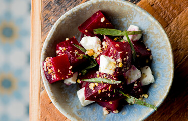Beet salad. Classic Italian salad with beets, mozzarella, spinach, arugula, Parmesan cheese, olive oil, lemon juice, salt and pepper. A Fine dining restaurant classic.
