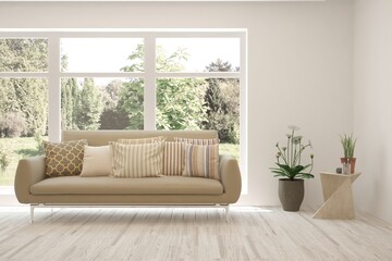 White living room with sofa and summer landscape in window. Scandinavian interior design. 3D illustration