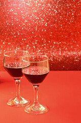 two glasses of wine on bright festive background