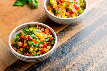Mediterranean Mezze Salad. A Mediterranean classic Israeli salad made with sweet bell peppers, fresh mint, feta cheese and dressed with olive oil, lemon, and salt and pepper.