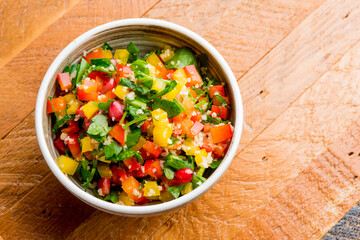 Mediterranean Mezze Salad. A Mediterranean classic Israeli salad made with sweet bell peppers, fresh mint, feta cheese and dressed with olive oil, lemon, and salt and pepper.