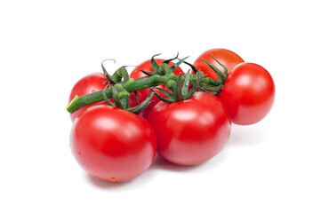 Red tomatoes with green stems  on white background