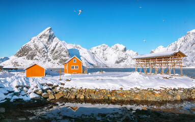 Fabulous winter view of Sakrisoy village and snowy mountaines on background.