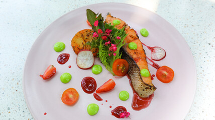 Grilled salmon fillet, slow cooked steak served with baked potato. Healty food concept.