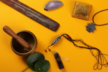Tibetan dzi bead amulet necklace, tibetan singing bowl and other Success and prosperity symbols on...