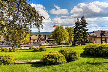Panoramic view of central market square of historic royal open-air museum town of Lanckorona in mountain region of Lesser Poland