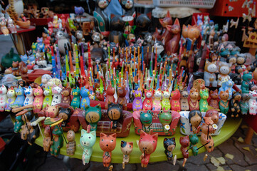 Cat dolls are displayed at the stalls.