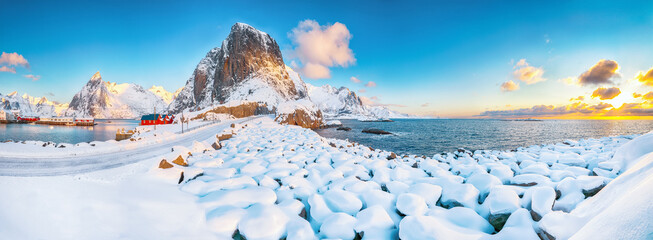 Gorgeous winter view on Hamnoy village with port and Festhaeltinden and Olstinden peaks on...