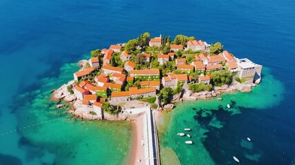 Aerial view of Sveti Stefan, island in Montenegro surrounded by Adriatic coast. Drone aerial 4K footage