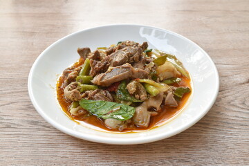 spicy stir-fried chicken gizzard couple liver with yard long bean and chili on plate