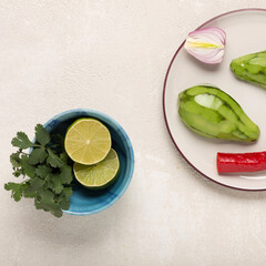 recipe for Mexican appetizer Guacamole with avocado and cilantro, top view