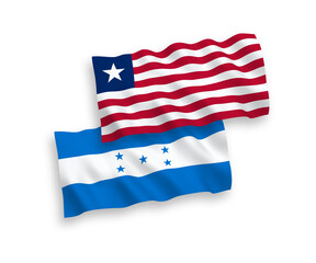National vector fabric wave flags of Liberia and Honduras isolated on white background. 1 to 2 proportion.