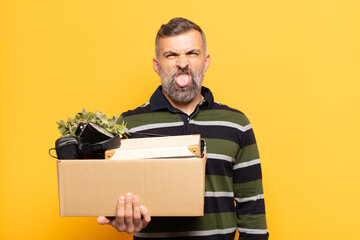 adult man feeling disgusted and irritated, sticking tongue out, disliking something nasty and yucky