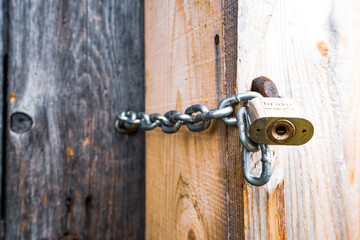 Iron lock on a closed door in an old house