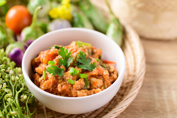 Northern Thai food (Nam Prik Ong), Spicy chili minced pork with tomatoes, Thai chili paste eating with vegetables